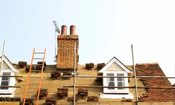 A roof being repaired, roofing & drainage, property maintenance London
