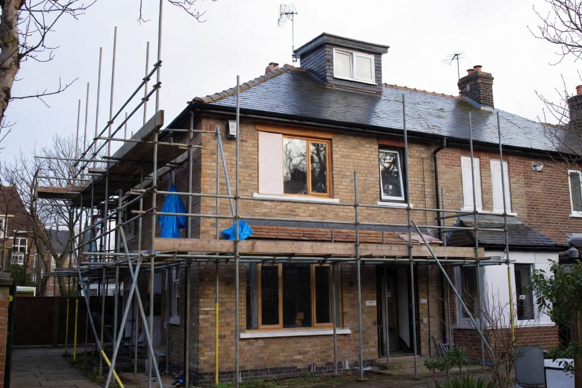 House refurbishment project in Putney with scaffolding around a residential property